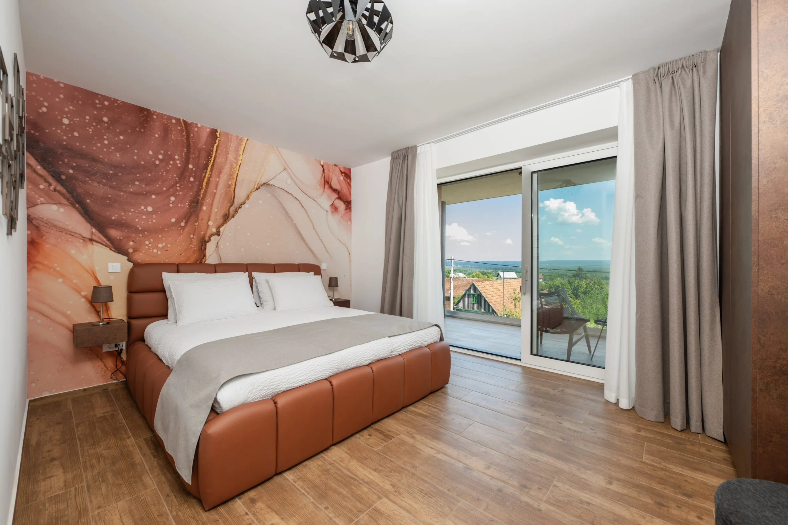 Elegant bedroom with balcony view at Villa Wood near Zagreb