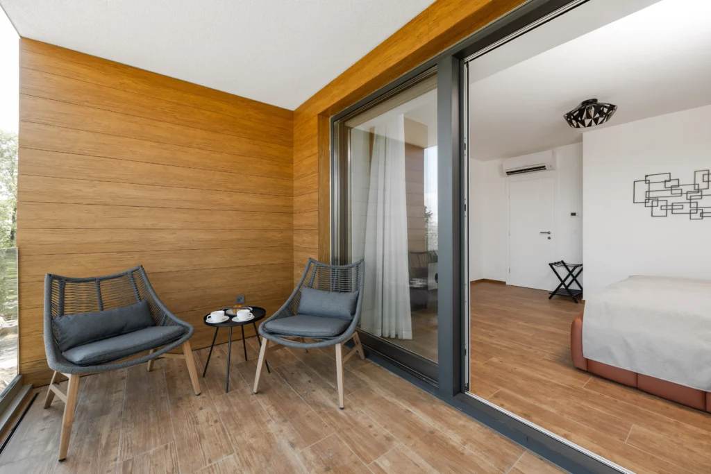 Private balcony seating area at Villa Wood luxury apartment