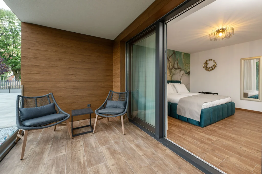 Elegant bedroom with balcony view at Villa Wood near Zagreb